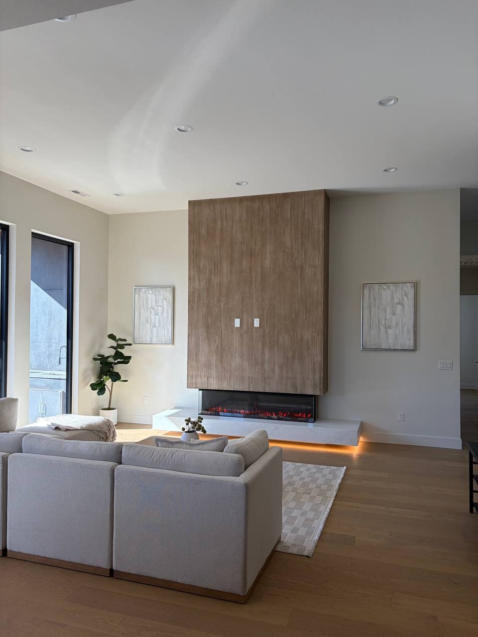 Full living room view with custom textured plaster fireplace as centerpiece, Barberton WA