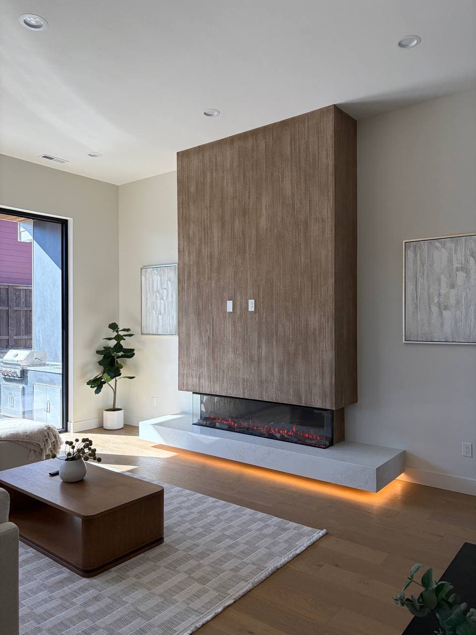 Close-up of "Thousand Lines" textured plaster technique on fireplace surround, Barberton WA