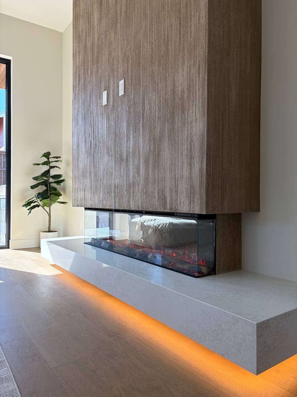 Custom textured plaster fireplace with thousand lines finish in a modern living room, Barberton WA