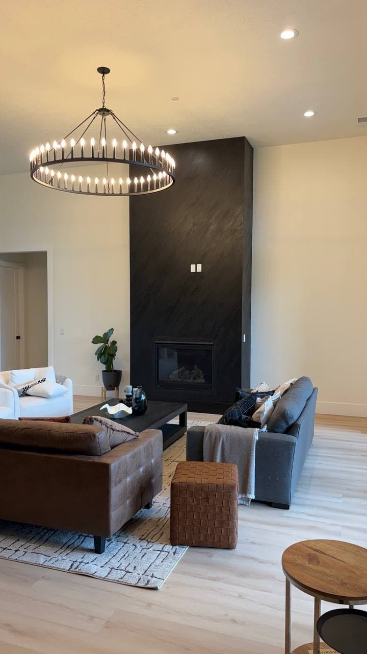 View of the newly remodeled living room anchored by the black textured fireplace, Hubbard OR